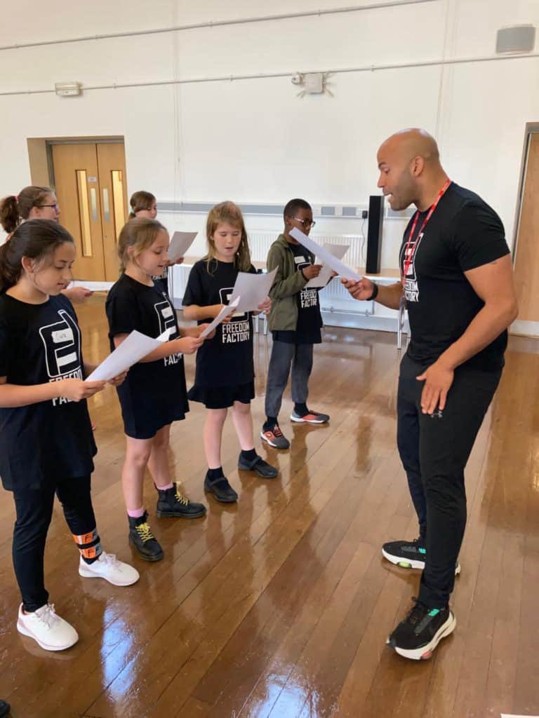 A mentor and some children at a freedom factory session